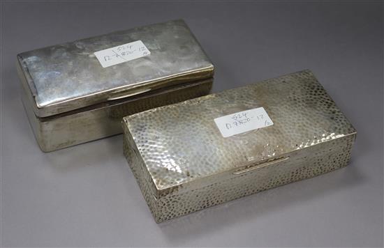 Two early 20th century silver cigarette boxes, largest 20cm.